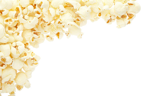 Fresh popcorn on a white plate with clipping path. Top view.