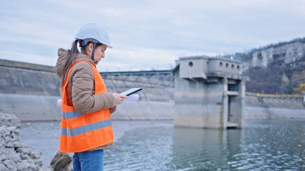 istock Female engineer working in hydroelectric dam. Ecology orientated. Renewable energy systems. 1419443328