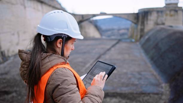 istock Female engineer working in hydroelectric dam. Ecology orientated. Renewable energy systems. 1419443338