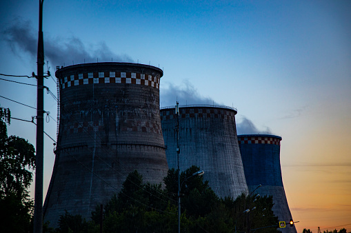 Coal fired power station silhouette at sunset