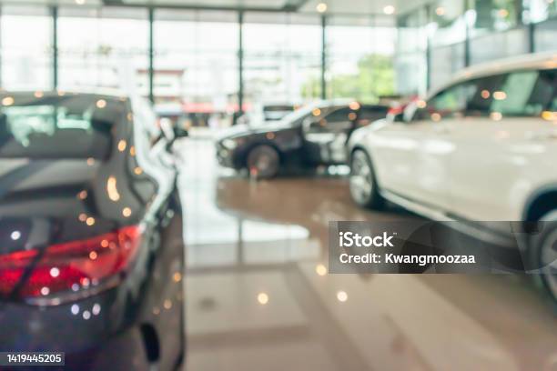 New Cars In Showroom Interior Blurred Abstract Background Stock Photo - Download Image Now