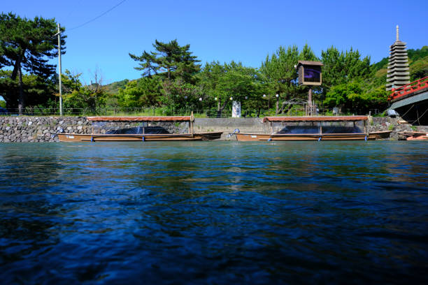 Cormorant fishing boats moored in Uji stock photo