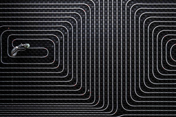 istock Floor heating pipes on black background 1419448368
