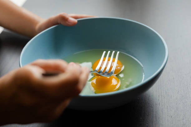 istock egg yolk in blue bowl close up 1419453644