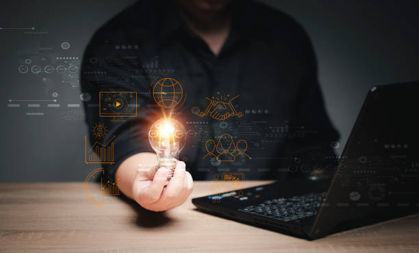 istock man Hand holding Light bulb Global Internet connection. Business global internet connection application technology and digital marketing, Financial and banking, Digital link tech, big data. 1419459256