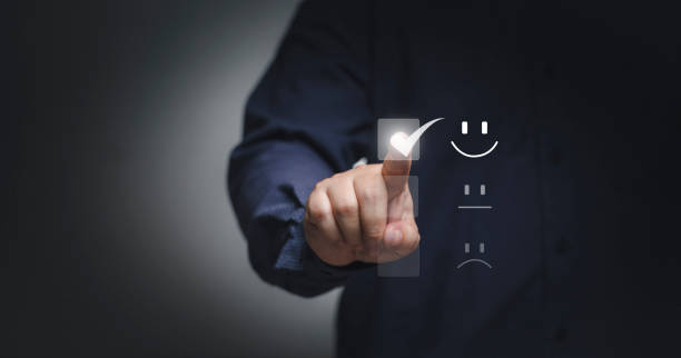 istock Customer service and Satisfaction concept ,Business people are touching the virtual screen on the happy Smiley face icon to give satisfaction in service. rating very impressed. 1419459350