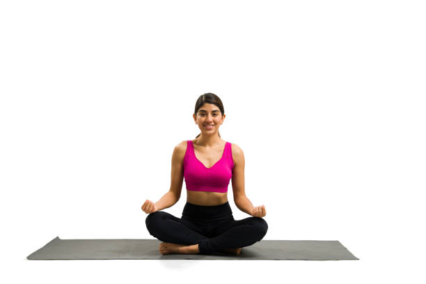 istock Smiling latin woman meditating during yoga exercises 1419462649