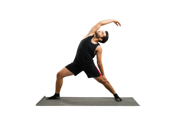 Asian man going for a boxing training session. He is doing stretching exercises in this photo.