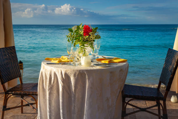 istock Romantic dinner: table for two and Beach Montego Bay at sunset - Jamaica 1419469859