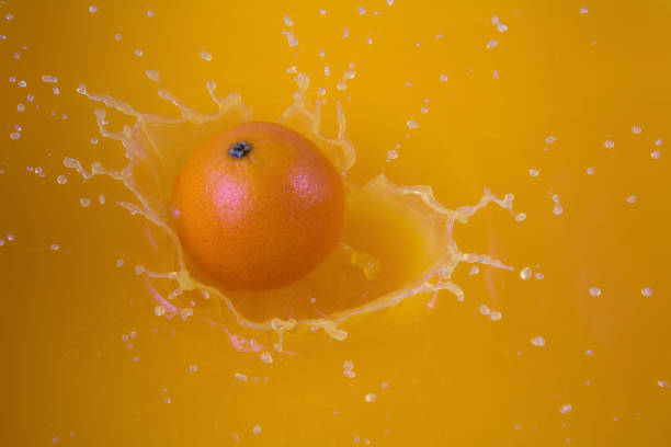 istock orange juice fruit slashing liquid drops healthy fresh drink 1419479576
