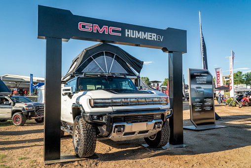 Loveland, CO, USA - August 28, 2022: GMC HUMMER EV pickup, world's first all-electric supertruck with a roof tent.