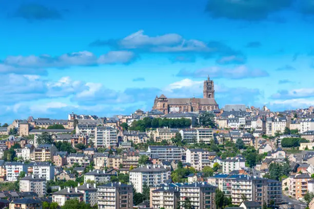 Photo of Rodez city view with church and houses during a sunny day
