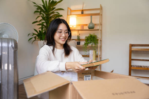istock Young woman preparing for moving into student accommodation. 1419485679