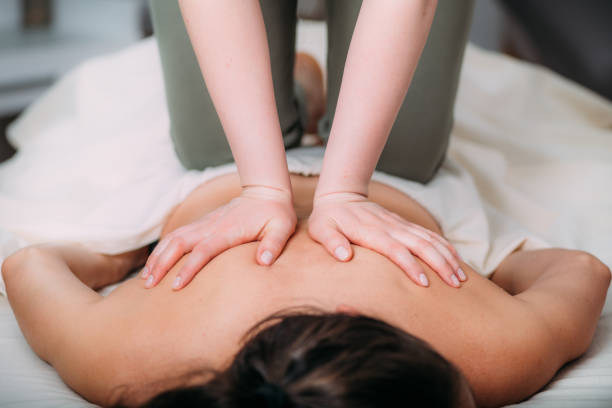istock Back massage in a massage salon, woman having a relaxing back massage. 1419487295