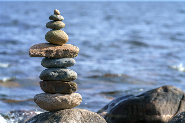 istock Pyramid of stones. Unstable balance of stone objects. 1419487845