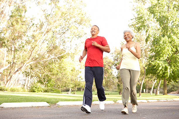 istock Senior Couple Jogging In Park 141948851