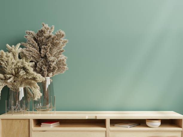 istock Green wall mock up on wooden cabinet. 1419490733