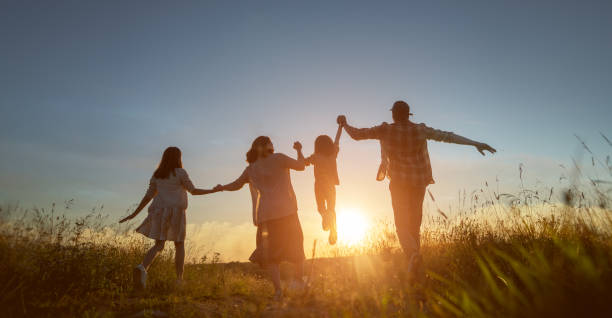 istock Happy family in the park 1419491698