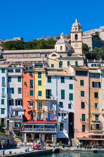 Pastel colored buildings lined up on the promenade of Porto Venere