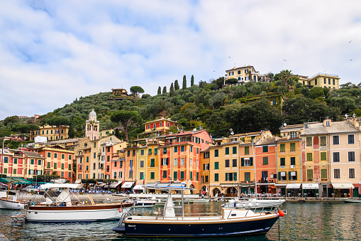 Characteristic colorful buildings lined up around the small harbour of Portofino, a very famous village on the Ligurian Riviera