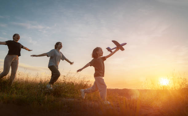istock Happy family at sunset 1419499836