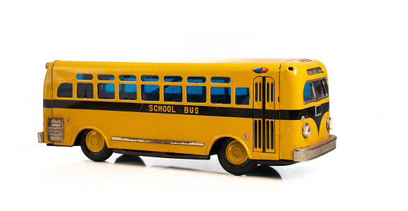 Back to school concept - yellow bus toy