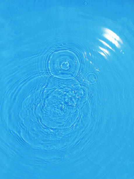 istock Defocus blurred transparent blue colored clear calm water surface texture with splashes and bubble. Trendy abstract nature background. Water wave in sunlight with copy space. Blue watercolor shining. 1419503871