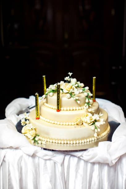 istock Multilevel wedding cake decorated with flowers and candles 1419508969