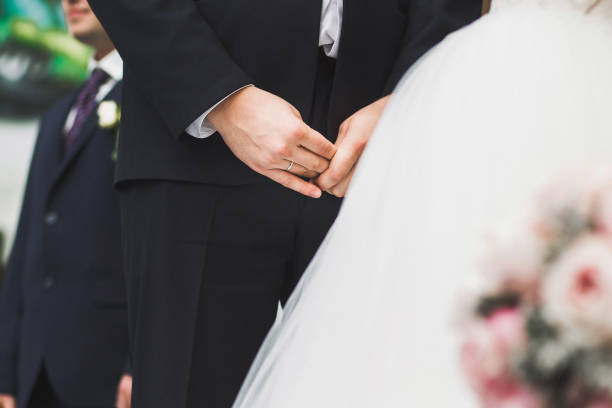 istock The ring on the groom's finger during the wedding ceremony 1419509782