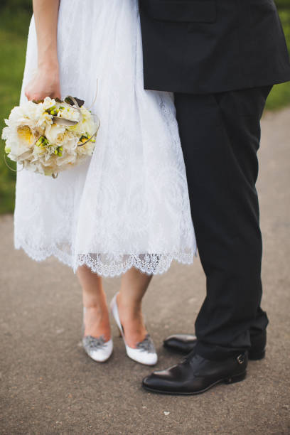 istock Bright wedding bouquet in hands of the bride 1419509816