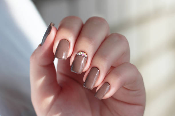 istock dark brown chocolate nail polish 1419511257