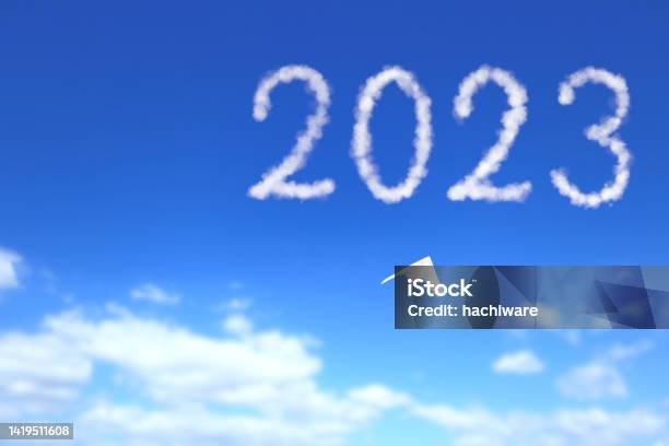 A Paper Airplane Flies Toward The 2023 Stock Photo - Download Image Now - 2023, Day, Freedom