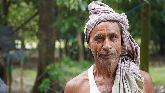Sitamarhi, Bihar, India- 14 June 2022 :A old man was watching field