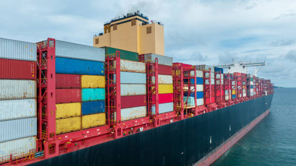 istock Side viewof  large cargo ship import export container box on the ocean sea on blue sky back ground concept transportation logistic and service to customer and supply change  forwarder mast 1419513681