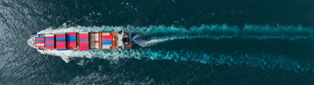 istock Cargo maritime ship with contrail in the ocean ship carrying container and running for export concept technology freight shipping by ship for Freight forwarding service 1419514069