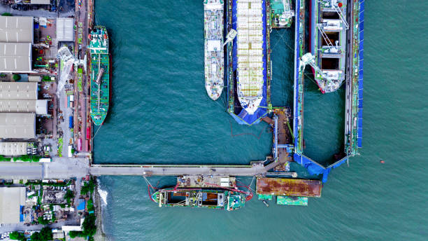istock cargo container ship at dry dock concept maintenance service working in the sea. Insurance and Maintenance Cargo Ship concept. Freight Forwarding Service maintenance Insurance 1419514924