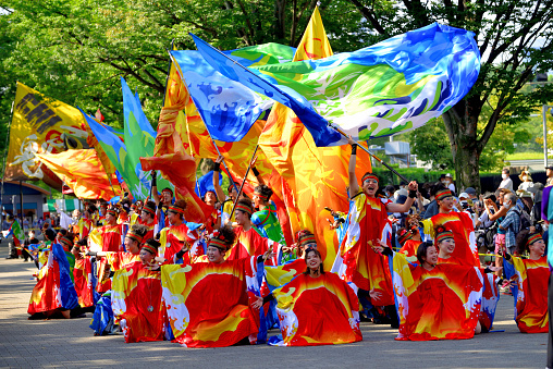 Tokyo, Japan-August 27, 2022:\nHarajuku-Omotesando Genki Matsuri Super Yosakoi was held in Harajuku and Yoyogi Park area, Tokyo, on the last weekend of August this year, after 2 years' absence due to the COVID-19 Pandemic. Men and women, young and old, performed very vibrant dancing in Super Yosakoi Parade..\nYosakoi is one of the most popular dance festivals in Japan, which originated in Kochi City, Shikoku Island, in 1954, and takes place for four days, including the eve of festival, from August 9 to 12 each year. Ever since, Yosakoi has become popular throughout Japan and Yosakoi festivals are now held all over throughout the year.