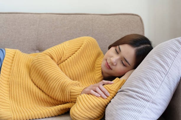 istock woman resting on the sofa at home 1419525936