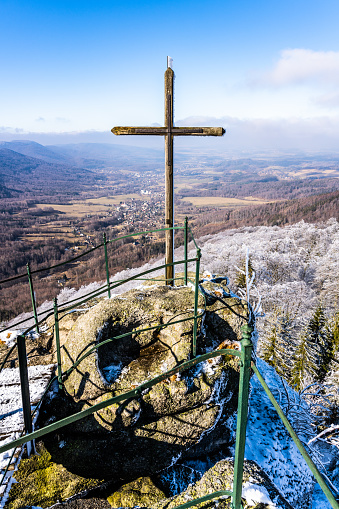Lookout from Palicnik - granite rock formation with viewpoint and summit wooden cross in Jizera Mountains, Czech Republic
