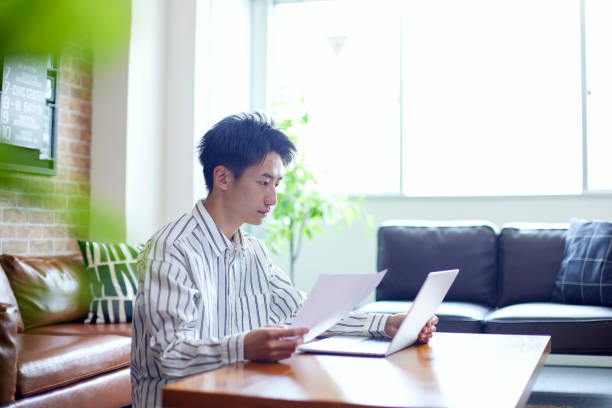 istock Japanese man relaxing in his room 1419535910