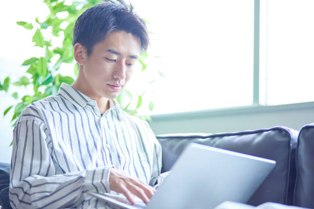 istock Japanese man relaxing in his room 1419536019
