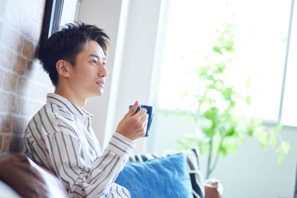 istock Japanese man relaxing in his room 1419536648