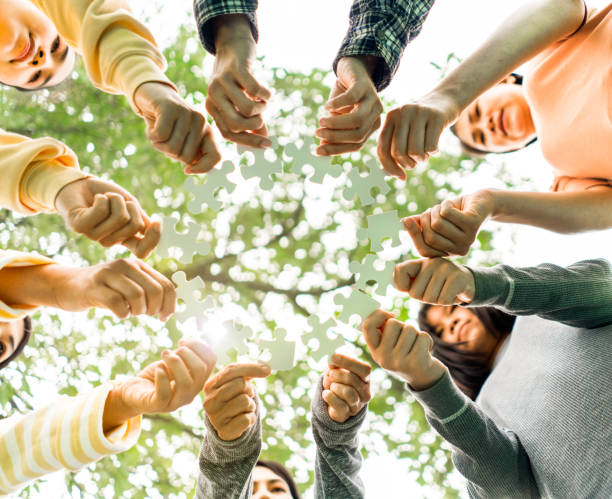istock Team Hands Empathy Trust Partner partnership grow and placing the jigsaw puzzle for connect business partner and connection integration start up concept Empathy teamwork. Team Volunter charity Faith. 1419537368