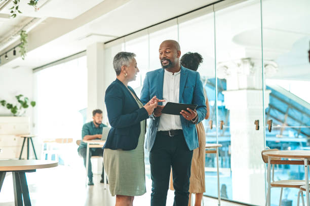 istock Teamwork, collaboration and business people working on strategy, vision or innovation idea in small corporate startup. Office manager and employee with tablet in marketing or advertising company 1419538129