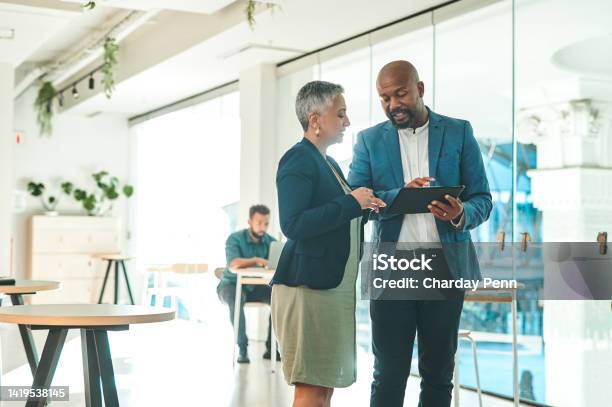 Business People Talking Digital Tablet At Work Planning Website And Looking For Creative Ideas On Internet Together In Modern Office Employees And Team Discussing Plan On Technology In Meeting Stock Photo - Download Image Now