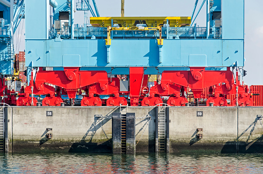 Rotterdam, The Netherlands, August 23, 2022: support structure with wheels of a crane on a container terminal at the quay of a harbour on Maasvlakte industrial area