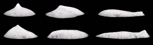 Set liquid white foam from soap or shampoo or shower gel. Abstract bubbles. isolated on a black background