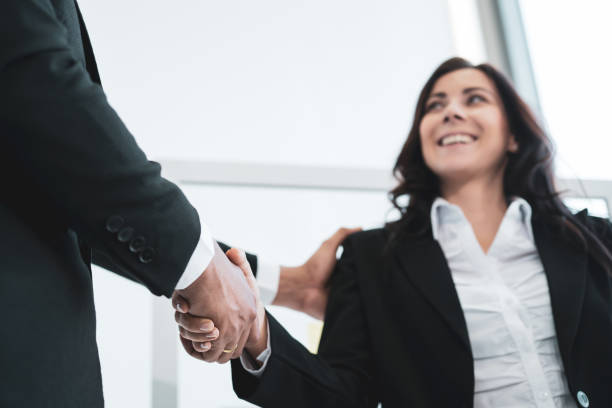 istock Business people making a hands shake. 1419545042