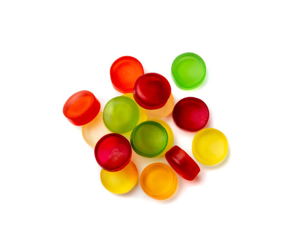 Round Gummy Candies Isolated Round gummy candy pile isolated. Chewing colorful marmalade pills, jelly gumdrops heap, gelatin candies set on white background top view chewy stock pictures, royalty-free photos & images