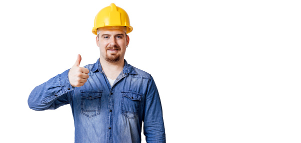 Young man with protective helmet and thumbs up